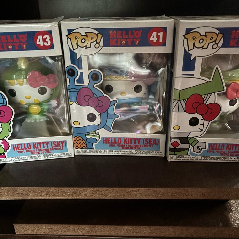 Three Hello Kitty Funko Pops